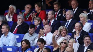 Gerald Davies, the 50th President of the Welsh Rugby Union, sits with Prince George and William, Prince of Wales and Patron of the Welsh Rugby Union