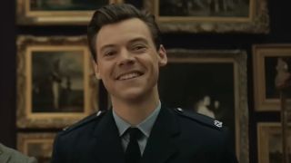 Harry Styles smiling at a painting in My Policeman.