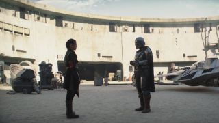 The Mandalorian speaking with Fennec Shand
