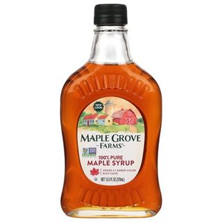 A glass bottle of Maple Grove Farms Pure Maple Syrup, Kosher, 12.5 Fl Oz with a black lid