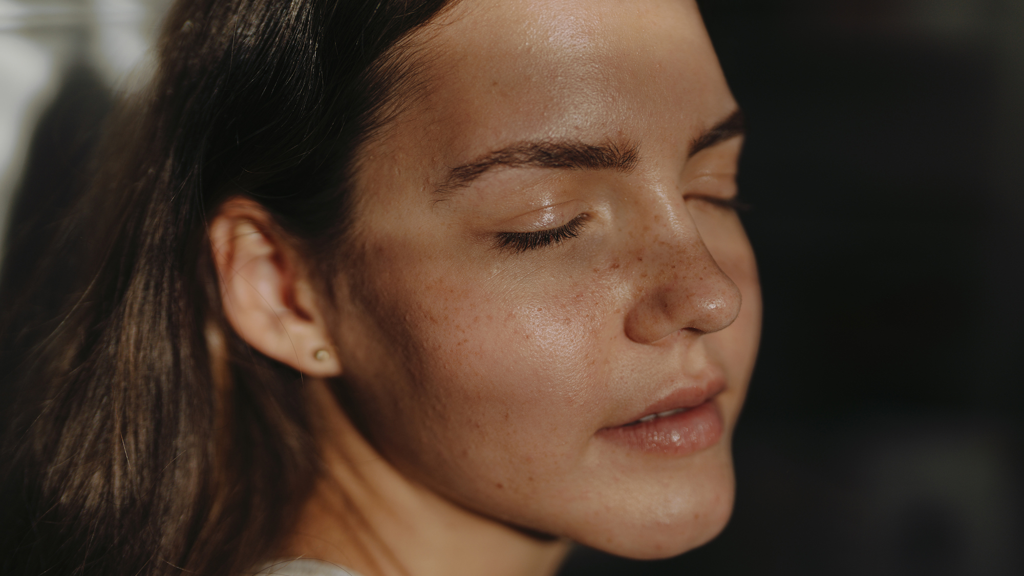 portrait of young woman with natural skin, no make-up and skin texture showing
