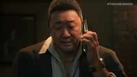 Don Lee on the phone in a dimly lit bar in the debut trailer for Gang of Dragon.