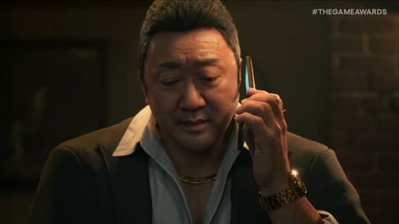 Don Lee on the phone in a dimly lit bar in the debut trailer for Gang of Dragon.
