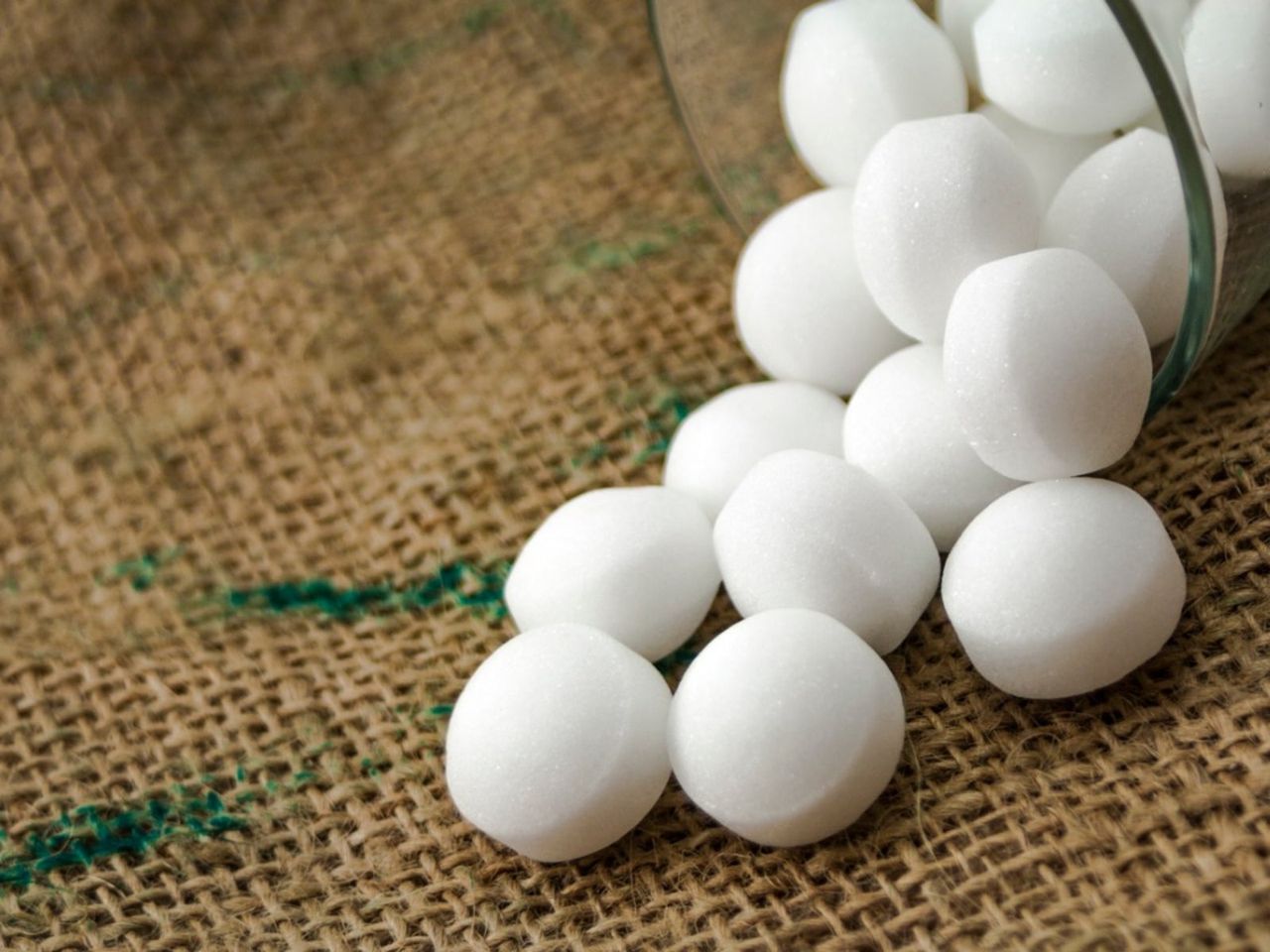 Mothballs Spilling Out Of Sideways Jar