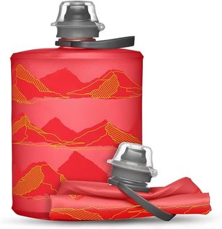 A Hydrapak Stow collapsible bottle with a red mountain motif
