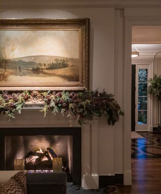 living room with fireplace with Christmas garland