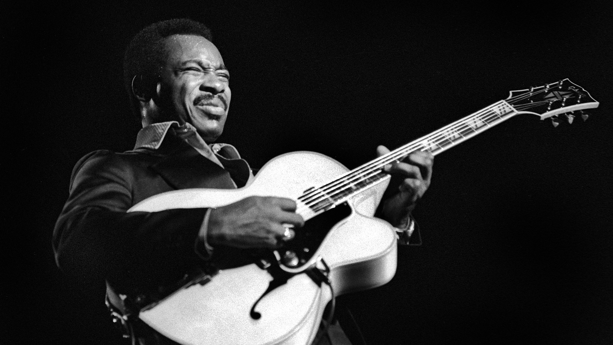 American Jazz musician George Benson plays guitar as he performs onstage at the University of Michigan, Ann Arbor, Michigan, October 13, 1976