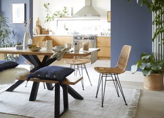 open plan kitchen with zoned with blue walls