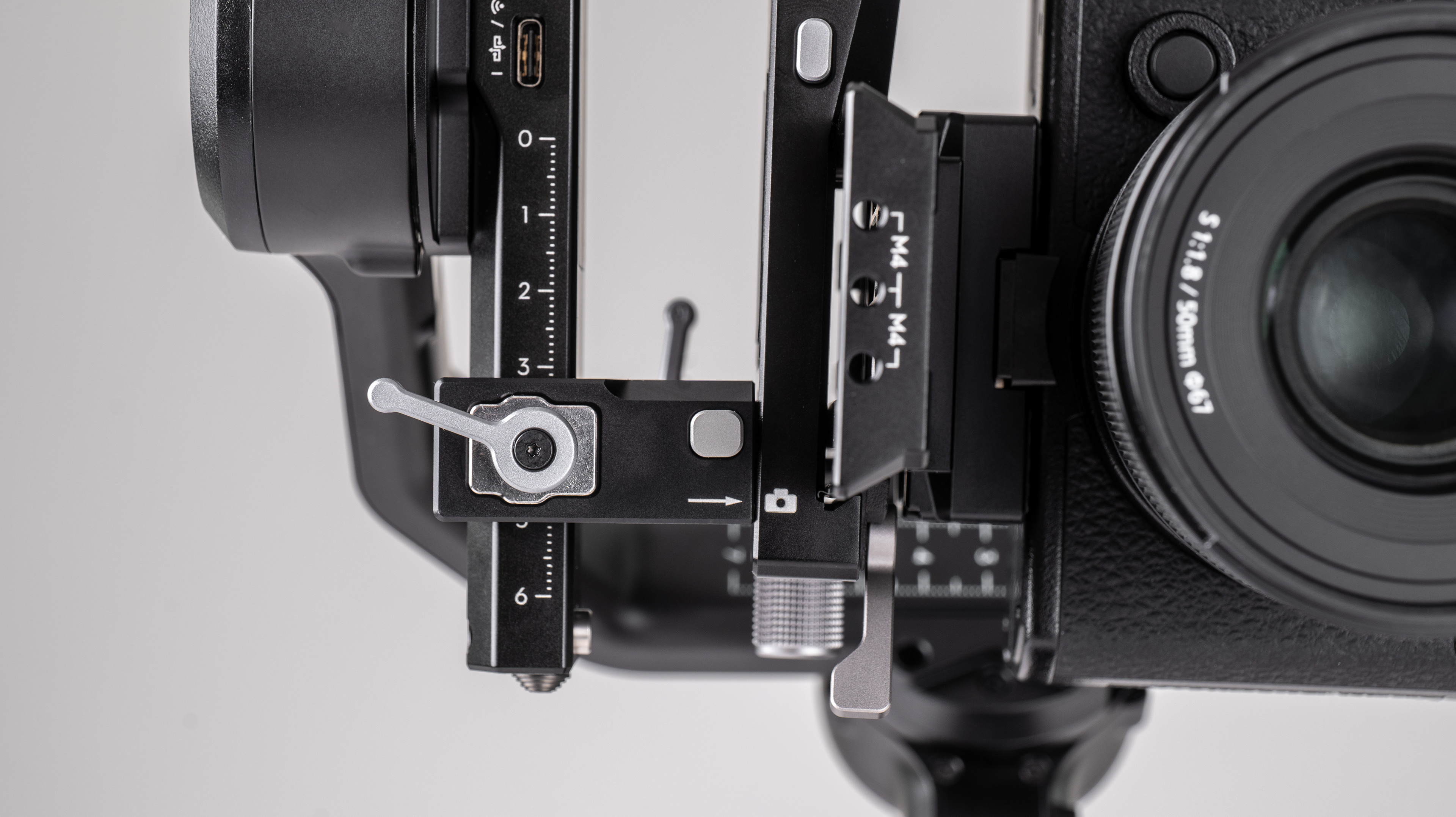 Close up of DJI RS 4 gimbal mount on a off-white background