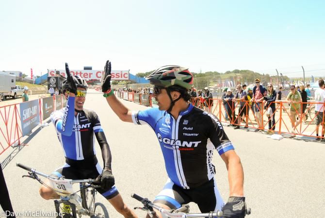 Giant riders Carl Decker and Adam Craig congratulate each other at the finish
