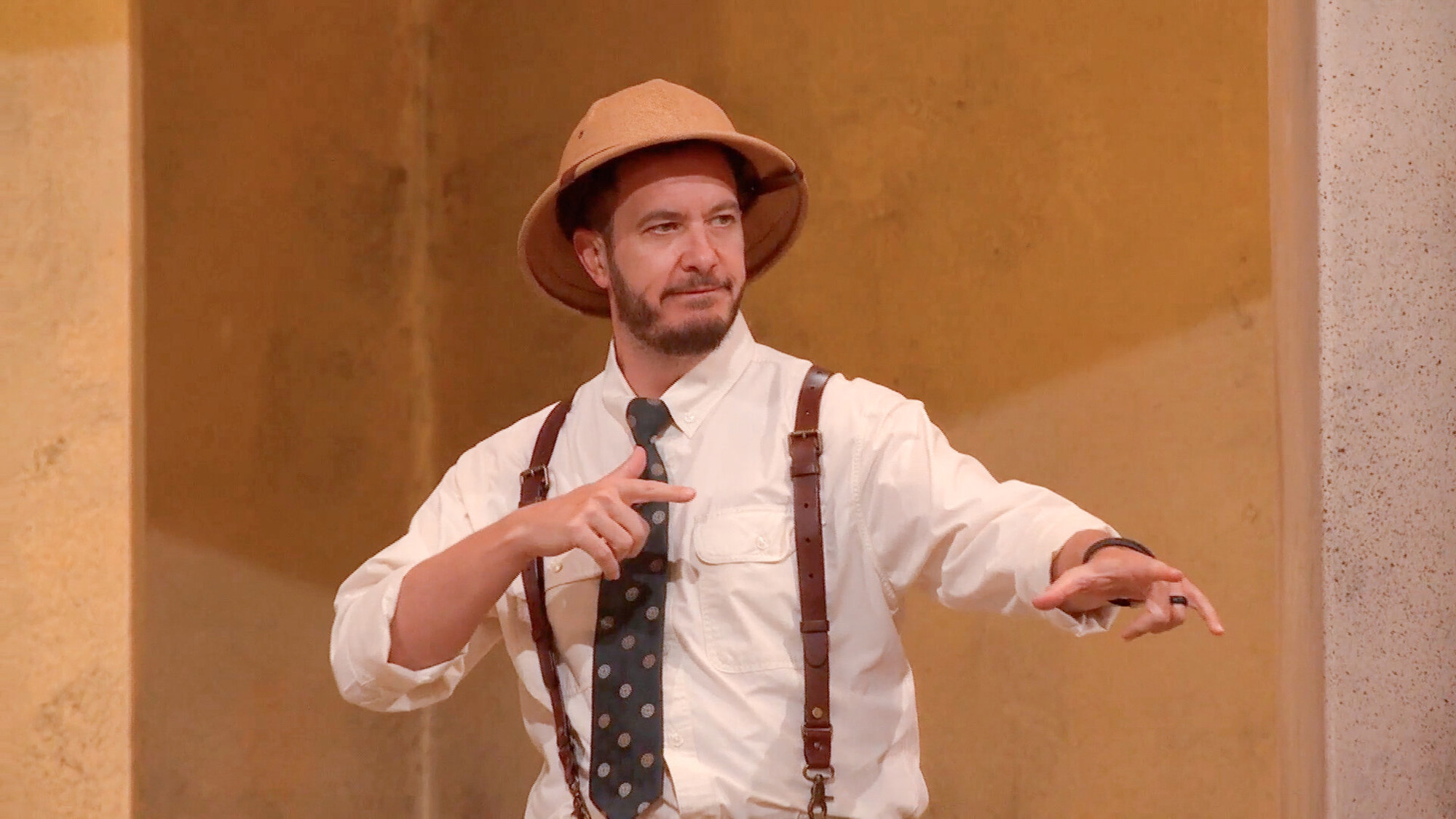 Rick Devens rocks a white shirt, a tie, a safari hat and suspenders during one Season 28 Big Brother challenge.