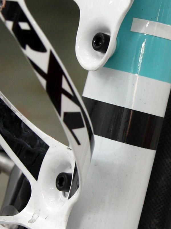 Alloy bolts secure the bottle cages on to the frame.