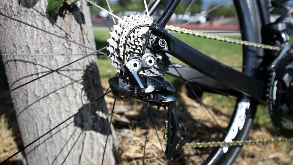 A Dura-Ace Di2 rear derailleur is paired with an 11-30 cassette and a gold KMC X11 SL chain