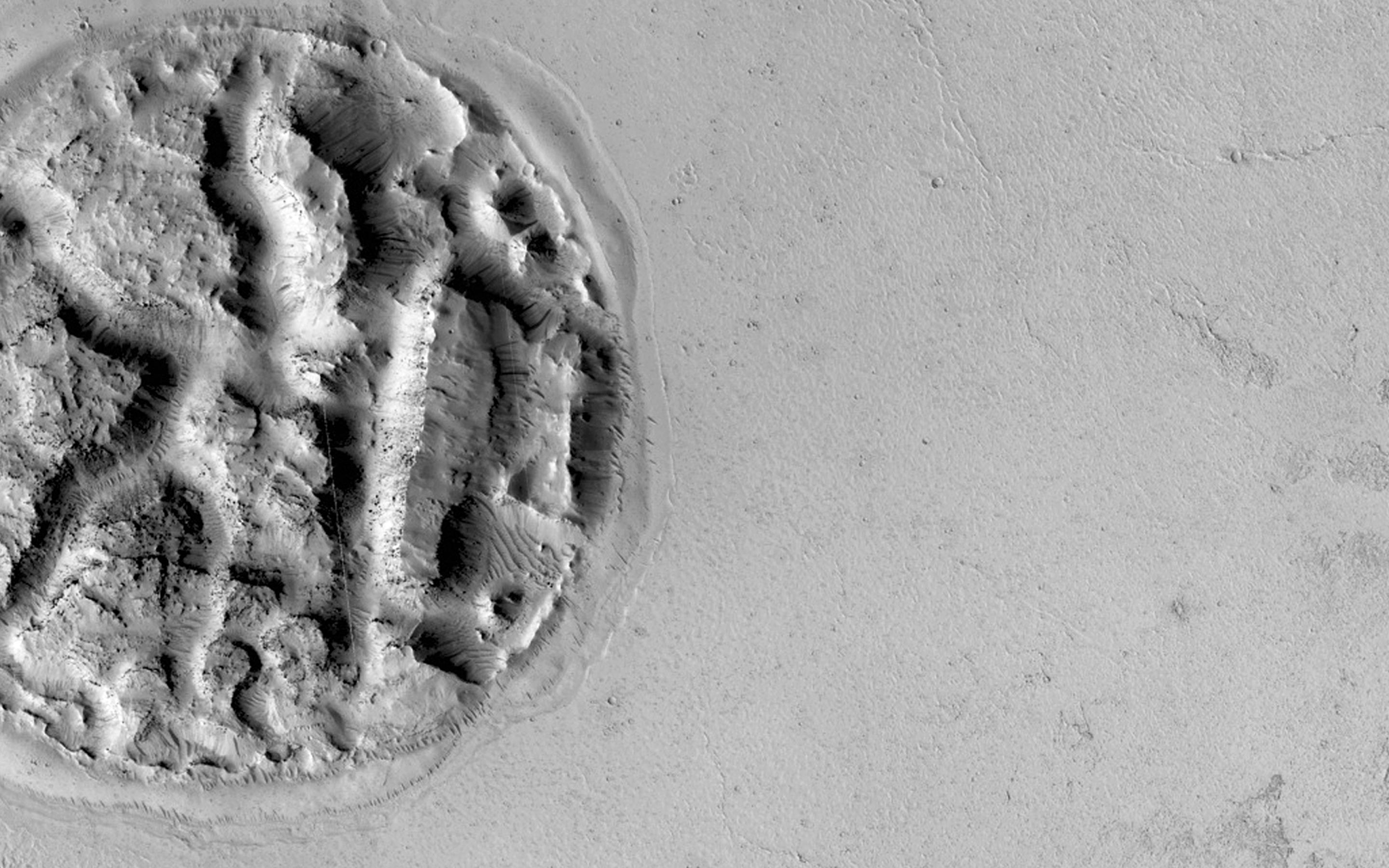 This strange Martian landform, photographed by NASA&#039;s Mars Reconnaissance Orbiter, possibly has a volcanic origin, scientists say.