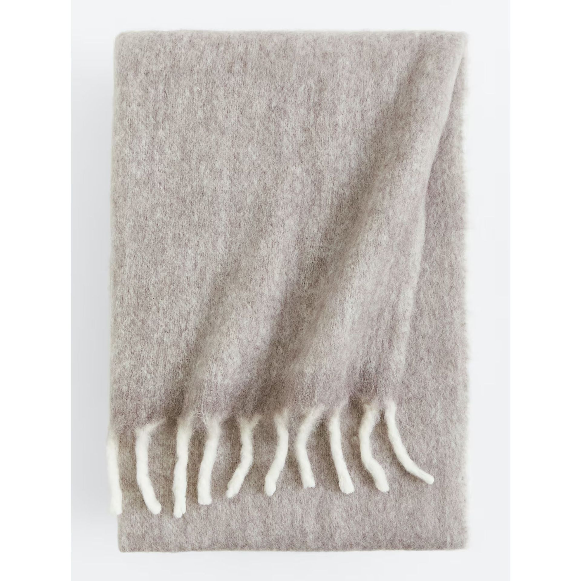 Soft gray throw with white tassels