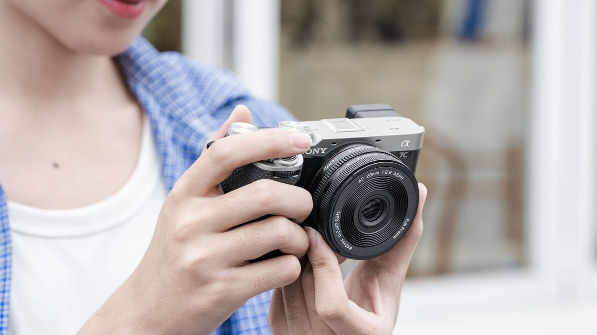 Viltrox AF 26mm F2.8 EVO lens attached to a Sony camera in user's hands