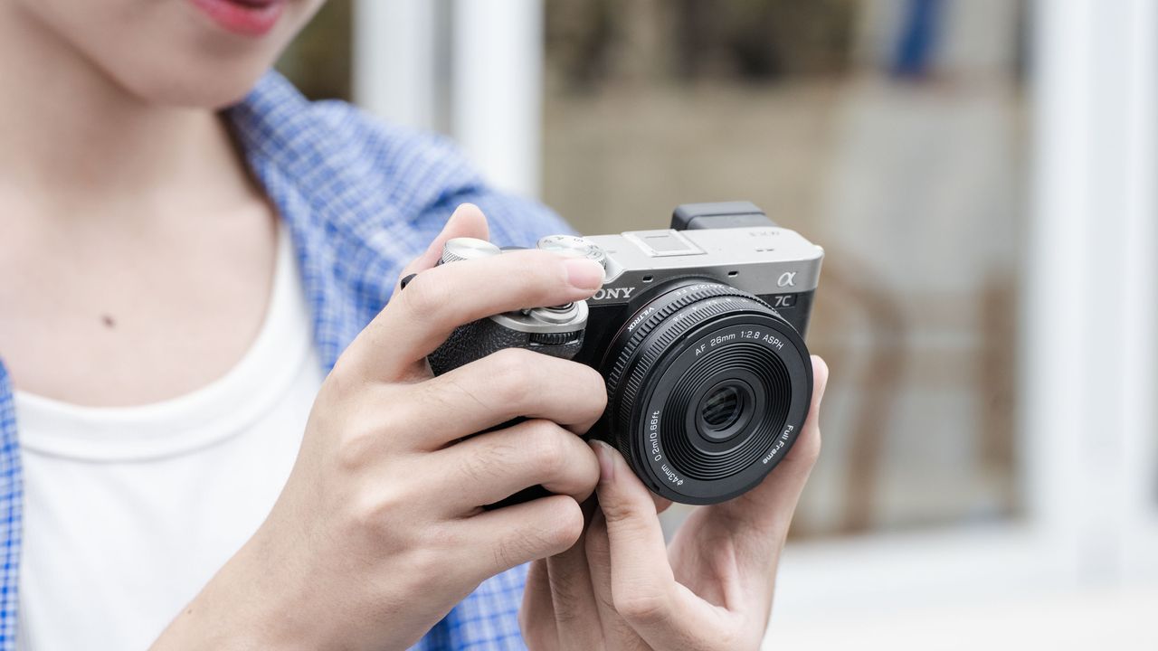 Viltrox AF 26mm F2.8 EVO lens attached to a Sony camera in user's hands