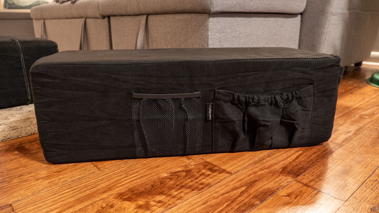 Pockets on the side of the cushions of the Couchmaster Cyboss couch desk