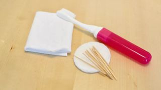 Cleaning supplies for Nintendo Switch: Toothbrush, gauze, toothpicks