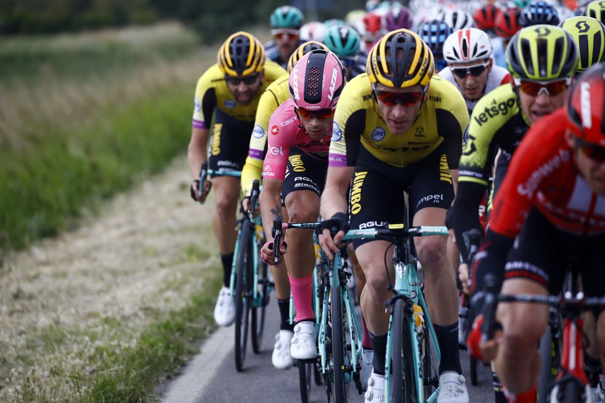 Roglic and his team ride in the peloton