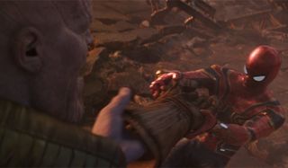 Spider-Man pulling the Infinity Gauntlet off of Thanos' hand in Avengers: Infinity War