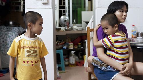 a chinese woman with her two children