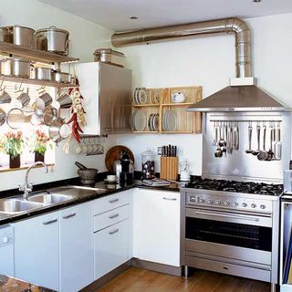kitchen with grey steel fixtures and wooden flooring