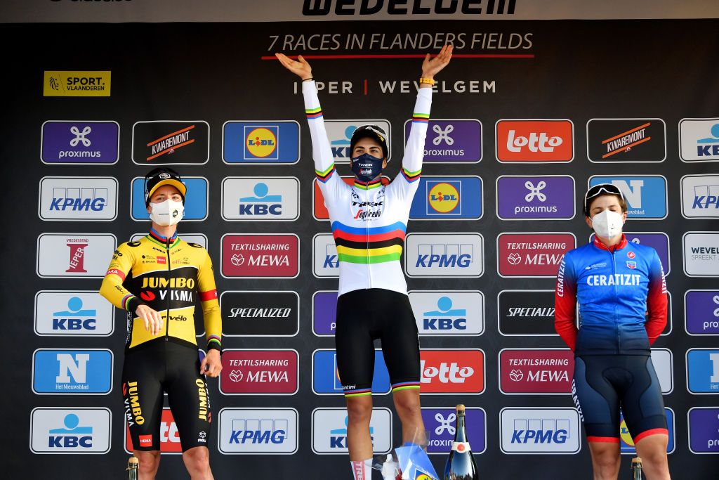 WEVELGEM BELGIUM MARCH 27 LR Marianne Vos of Netherlands and Jumbo Visma Team on second place race winner Elisa Balsamo of Italy and Team Trek Segafredo and Maria Giulia Confalonieri of Italy and Ceratizit WNT Pro Cycling Team on third place pose on the podium during the podium ceremony after the 11th GentWevelgem In Flanders Fields 2022 Womens Elite a 159km one day race from Ypres to Wevelgem GWEwomen UCIWWT on March 27 2022 in Wevelgem Belgium Photo by Luc ClaessenGetty Images