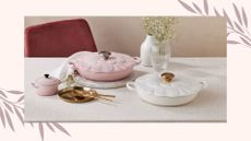  lifestyle image of the new Le Creuset petal shallow casserole in both pink and white colourways on table with flowers and golden props 