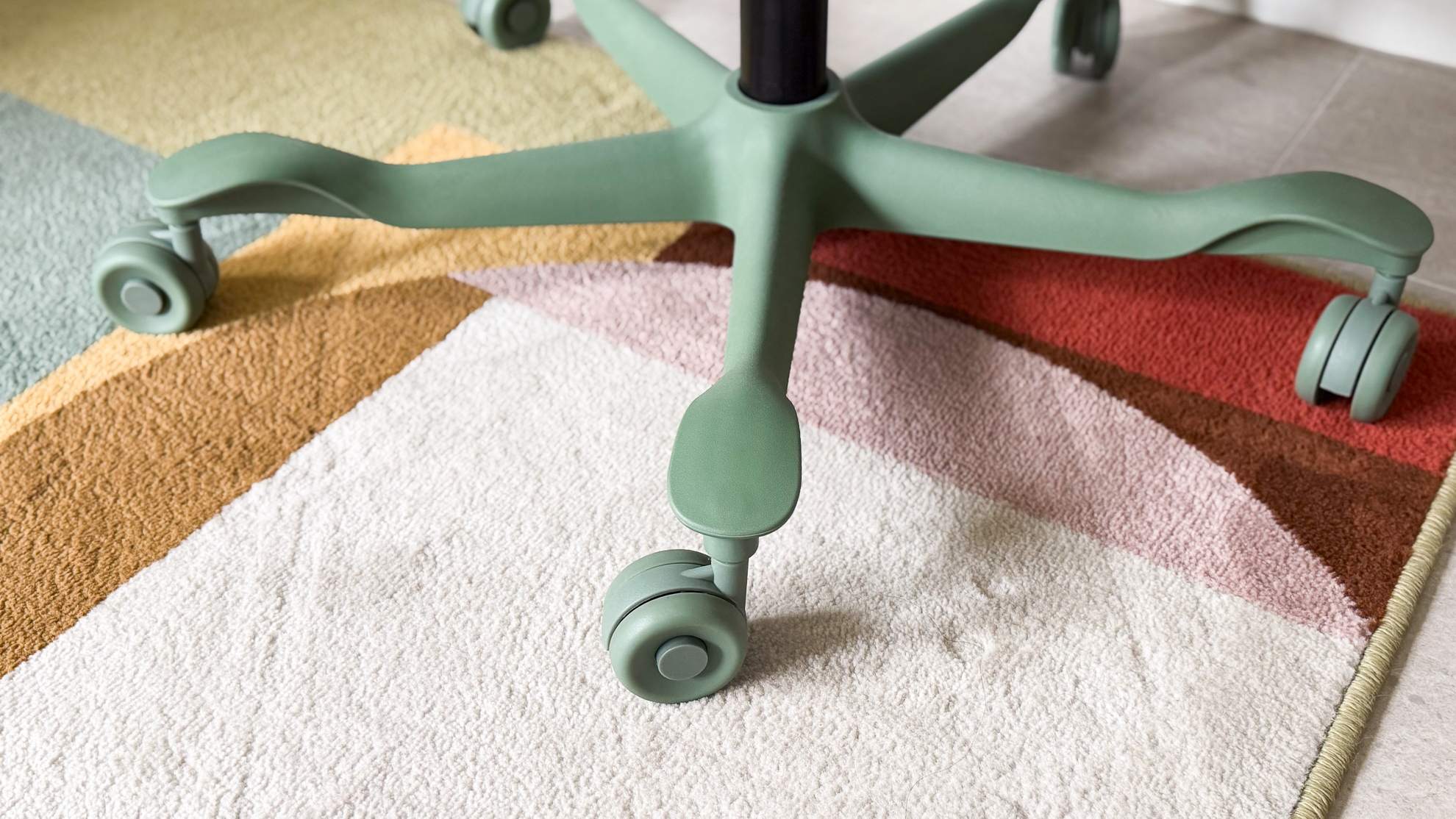 The matching-colour caster wheels and base of the ErgoTune Vesby office chair