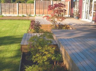 a simple garden decking idea to create levels