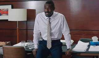 Molly's Game Idris Elba smiling in suit