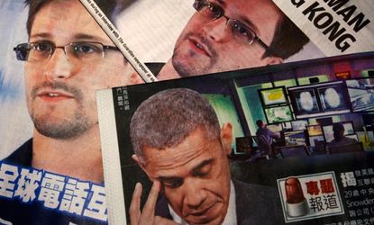 Edward Snowden and President Obama are seen on the front pages of local newspapers, in Hong Kong.