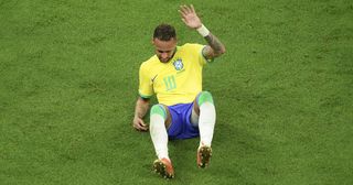 Neymar of Brazil lies on the ground after injury during the FIFA World Cup Qatar 2022 Group G match between Brazil and Serbia at Lusail Stadium in Lusail City, Qatar on November 24, 2022.