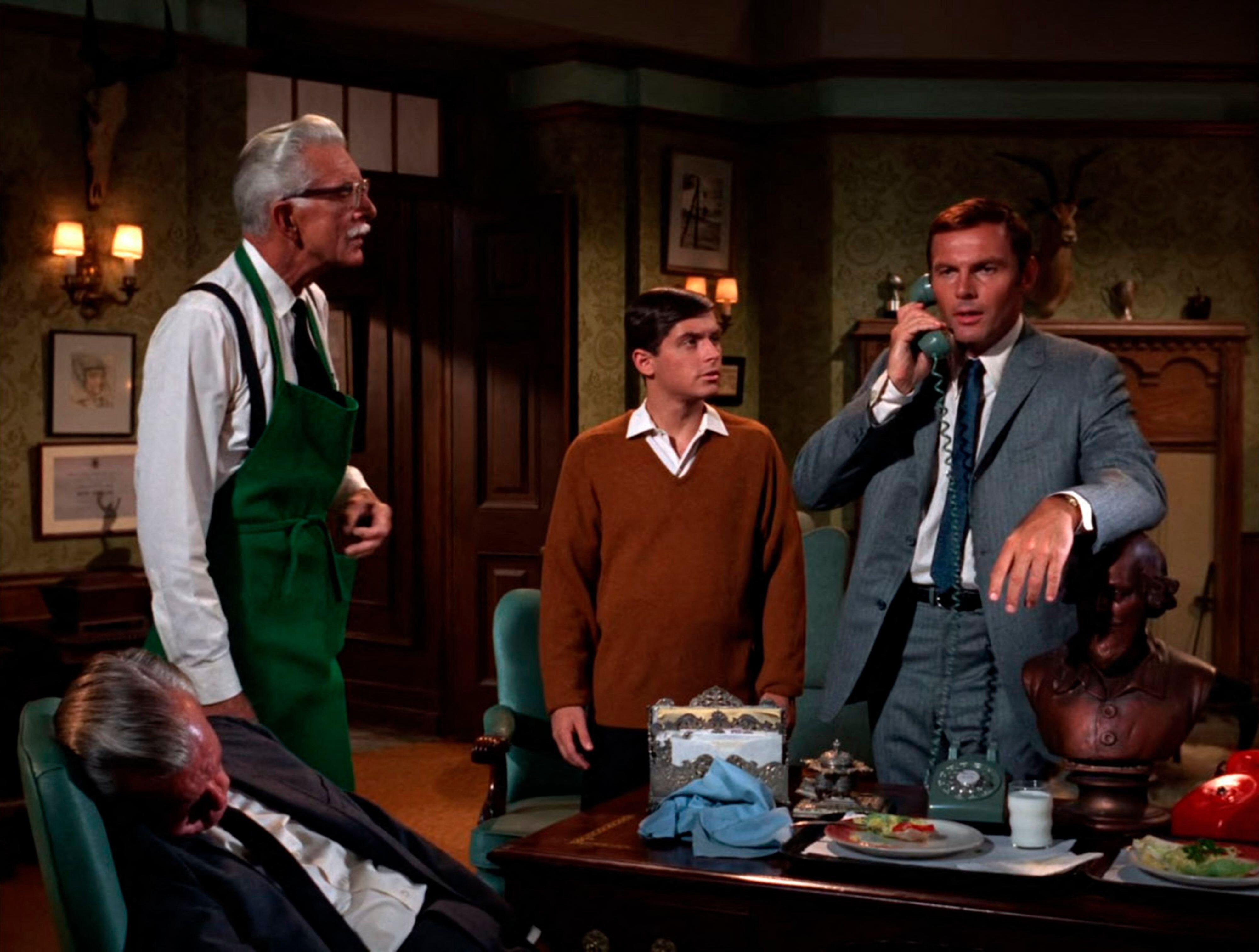 Alan Napier as Alfred with Adam West as Batman and Burt Ward as Robin in the original 1960s TV adaptation of Batman.