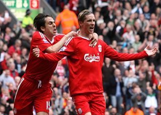 Torres celebrates scoring his second goal of an eventual Anfield hat-trick against Hull in September 2009