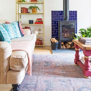 living room with sofa and wood burner