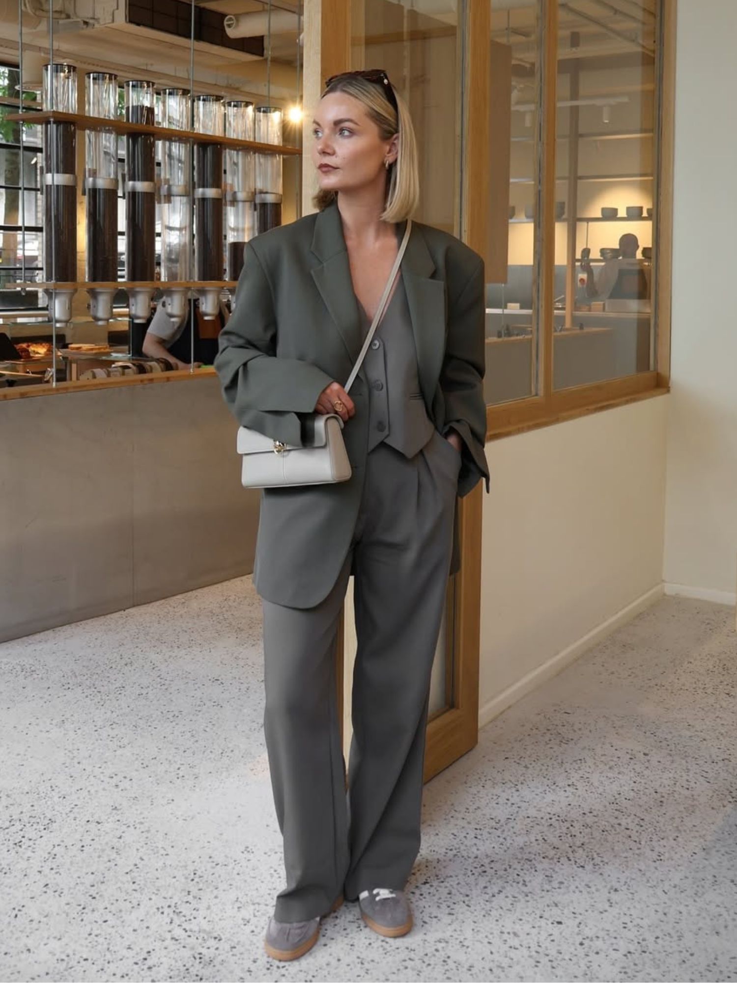 @ninaleacaine easy autumn outfits wearing a trouser suit and trainers