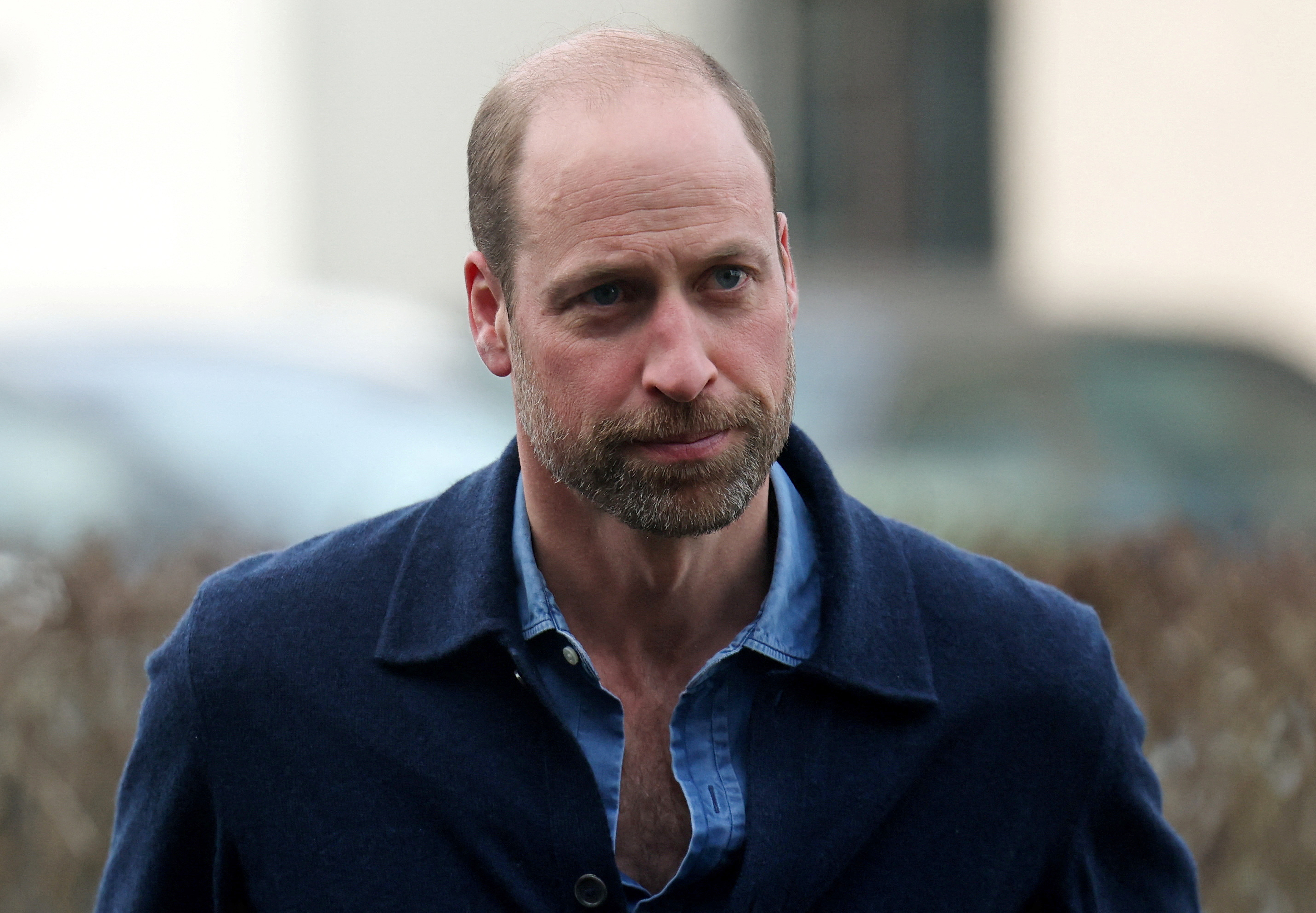 Prince William wearing a blue shirt