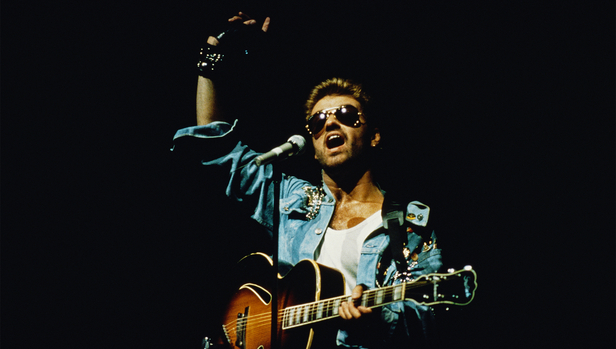English singer and songwriter George Michael (1963-2016) performing on stage during the Japanese/Australasian leg of his Faith World Tour, February-March 1988.