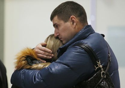 Relatives react to news of Russian plane crash