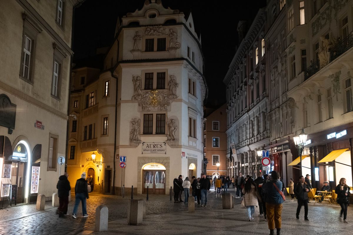 A street in Prague lit up at night