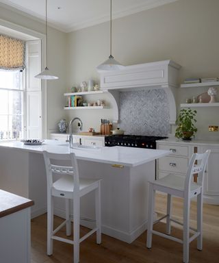 White kitchen with island and seating