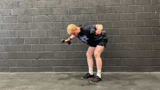 TechRadar fitness writer Harry Bullmore demonstrating a rear delt dumbbell raise