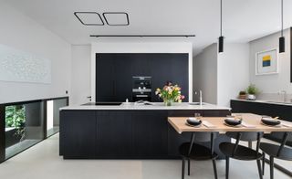 A modern kitchen also sits on the ground floor, towards the rear of the property
