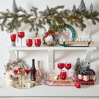 Kitchen shelves with festive glasses and tablewarre