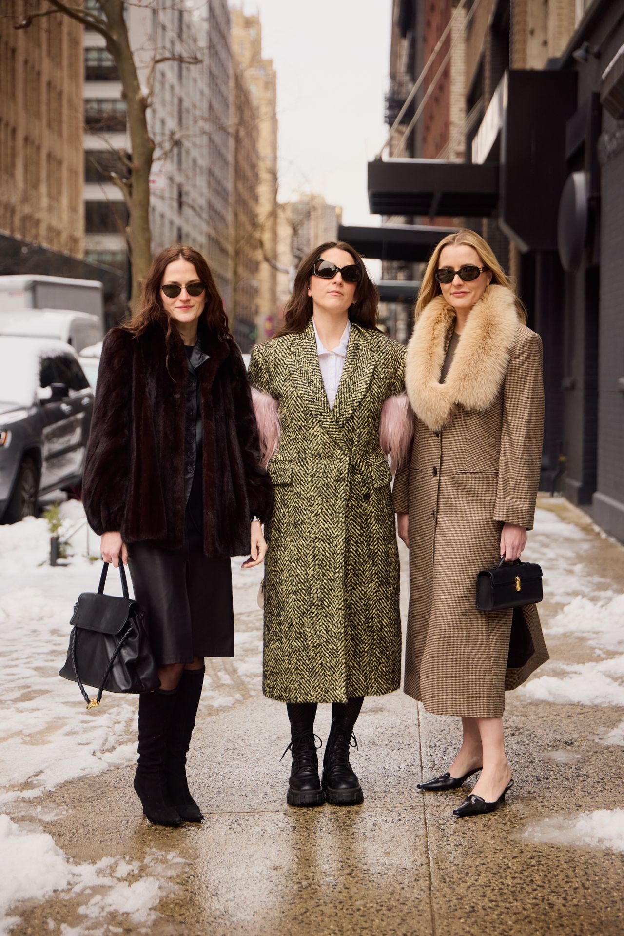 Eliza Huber, Tara Gonzalez, and Kristen Nichols wearing fur coats during F/W 25 fashion week in New York.