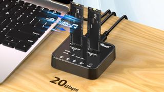 Rosewill SSD cloner and eraser on a desk, connected to a laptop