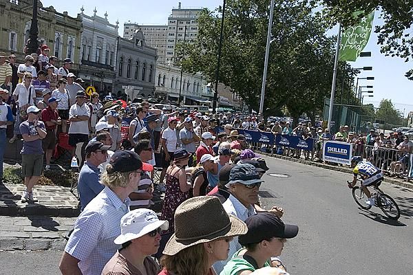 Fans watch Baden Cooke (Skilled/Lowe Farms) speed into a roundabout in Williamstown.