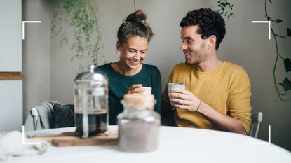 Woman and man sat at dining table with cup of coffee and filter, talking, representing how to establish deal breakers in a relationship
